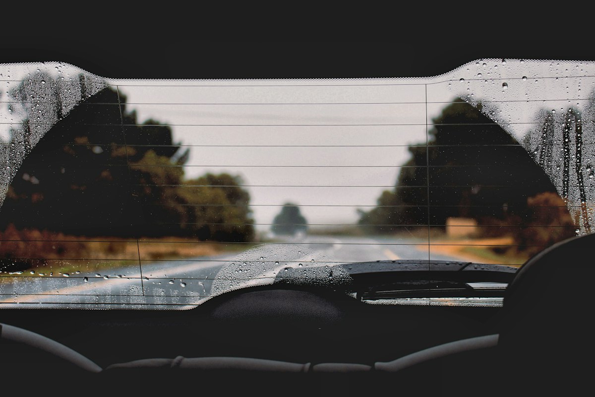hazy film on the inside of a car windshield